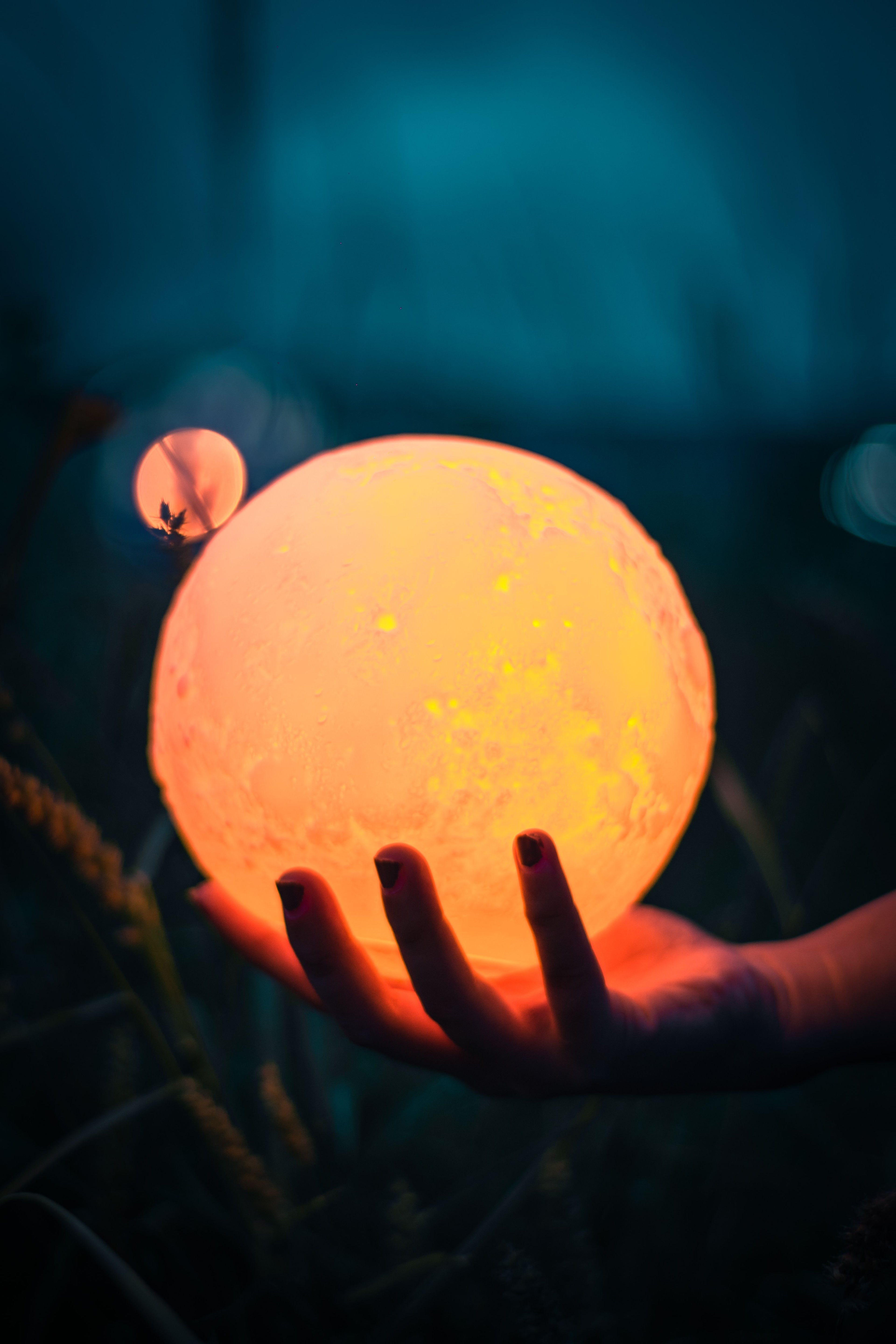 Moon lamp warm glow on nightstand