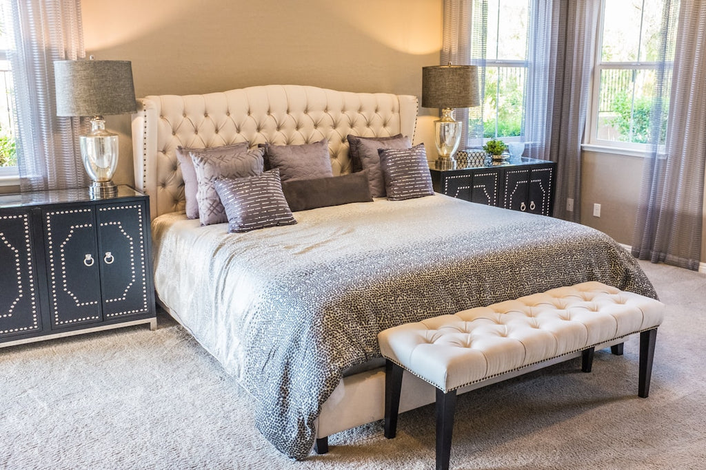 Cozy bedroom with soft blanket and warm ambient lighting